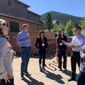 Growing Water Smart participants stand in a circle outside.