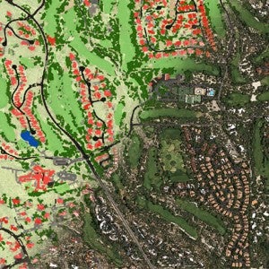 Image shows a high resolution satellite image of a residential area in Tucson, Arizona. Half of the image is overlaid with red to indicate buildings, black to indicate roads, blue to indicate water, and various greens to indicate land and vegetation. The other half of the map looks like a traditional satellite image that shows the landscape as a photograph from very high above.