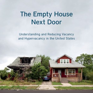 Cover of the report titled "The Empty House Next Door" by Alan Mallach. Cover shows two houses side-by-side, one that looks lived in and the other that appears abandoned, with the roof caving in and the foliage around the house overgrown.