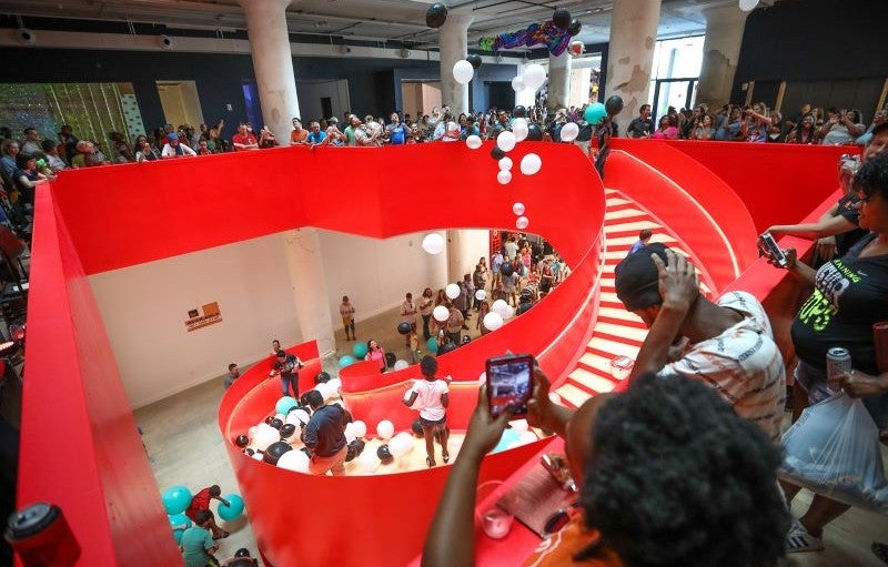Crosstown Concourse, Memphis People gather on a red staircase to celebrate the opening of the Crosstown Concourse building in Memphis, Tennessee.