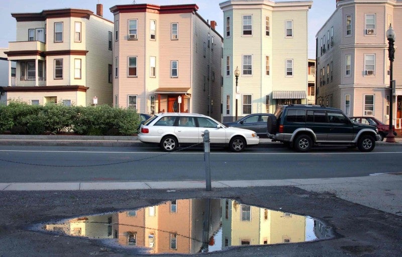 Credit: DenisTangneyJr/iStockphoto via Getty Images An East Boston neighborhood showcases its stock of triple-deckers.