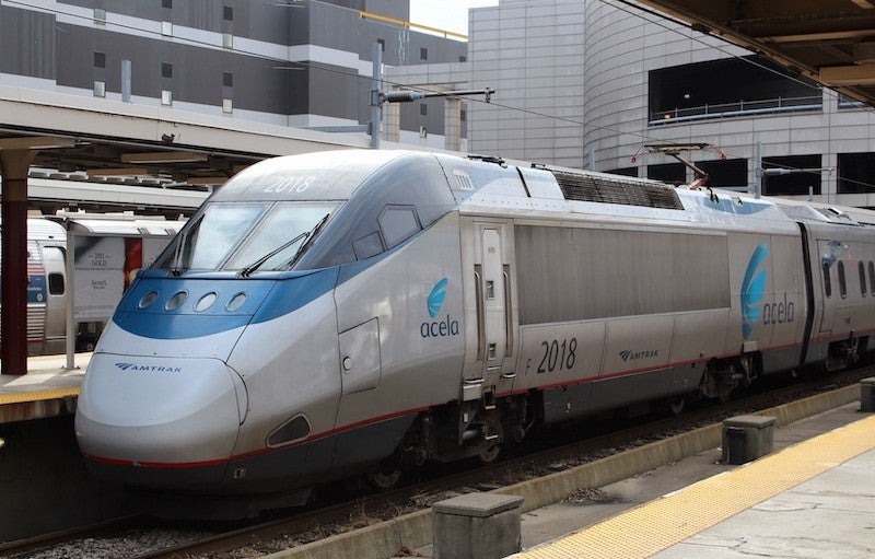 Acela train approaches a station