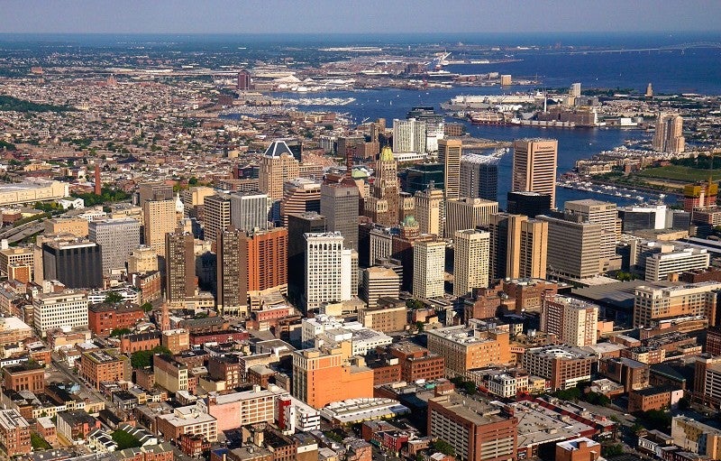 Baltimore is one of several cities seeking higher contributions from tax-exempt nonprofits in the face of fiscal pressures. Credit: Opacity via Flickr CC BY 2.0. Aerial view of the city of Baltimore.