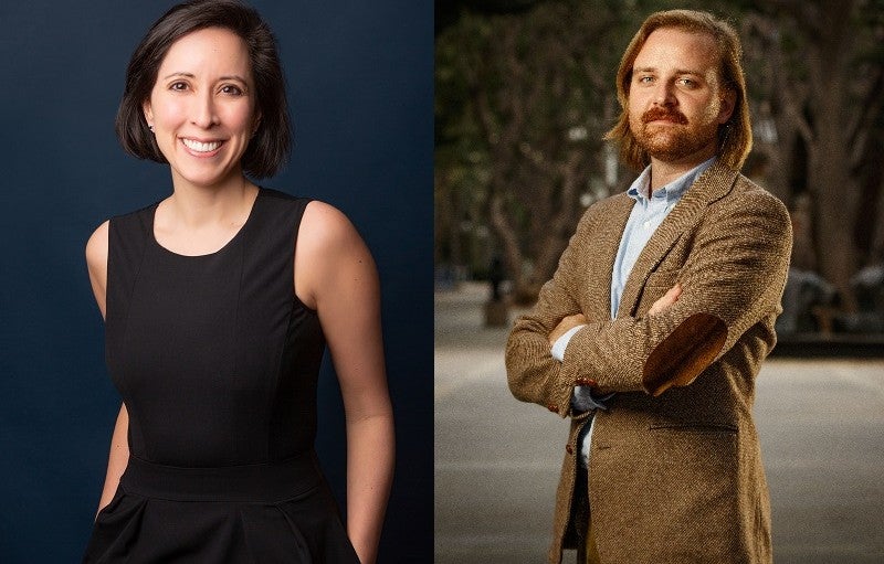 A man and a woman stand for posed photographs.