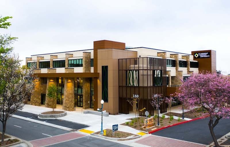 Image of CLU headquarters, a several story building at the corner of an intersection.