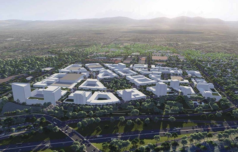 Planners in fast-growing cities like Westminster, Colorado, where a new "downtown" is taking shape on the site of a former shopping mall, are increasingly integrating water usage into their work. Credit: City of Westminster. Photograph shows an aerial view of Westminster, Colorado. Near the top of the image, you can see a mountain range in the distance. The middle of the photograph consists of a tree-covered landscape with a complex of roughly 20 new, white, modern buildings amid a small number of older buildings. A couple of larger roads run across the bottom of the photo, just below the white buildings.