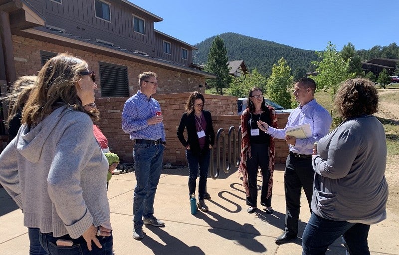 Growing Water Smart participants stand in a circle outside.
