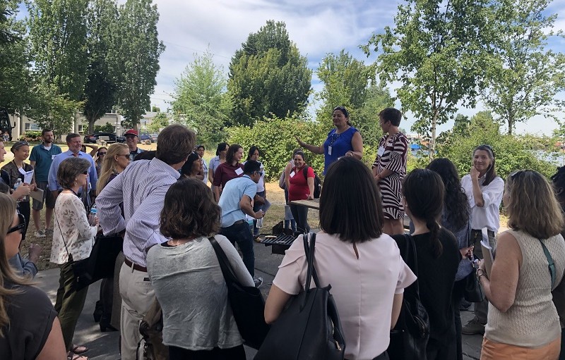 Paulina Lopez speaks to attendees of the Grantmakers in Health Conference in June as part of a tour of the South Park neighborhood.