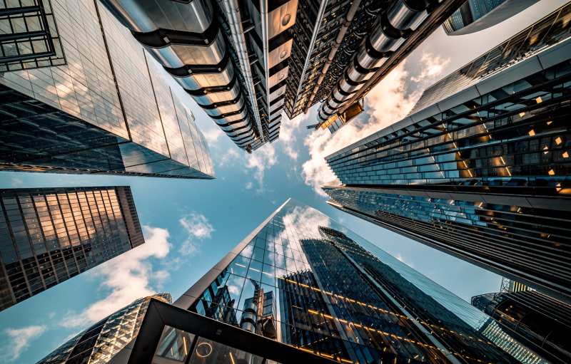 Image: An upwards view of skyscrapers.