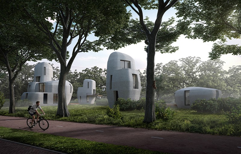 An architect's rendering shows four grey, rounded, and futuristic-looking homes along a tree-lined street with a bicyclist riding along a bike lane in the foreground. Credit: Houben en Van Mierlo Architects