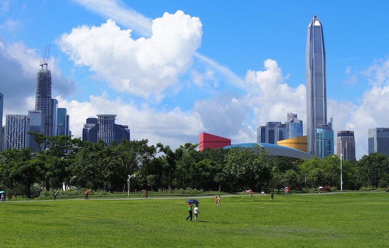 An image of Shenzhen, China with an expansive park in the foreground.