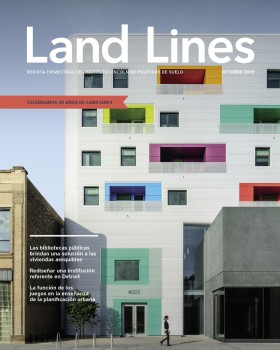La portada de la edición de octubre de 2019 de Land Lines muestra Independence Branch Library and Apartments en Chicago, un moderno edificio de desarrollo de uso mixto blanco con ventanas coloridas que combina una biblioteca pública con viviendas asequibles.